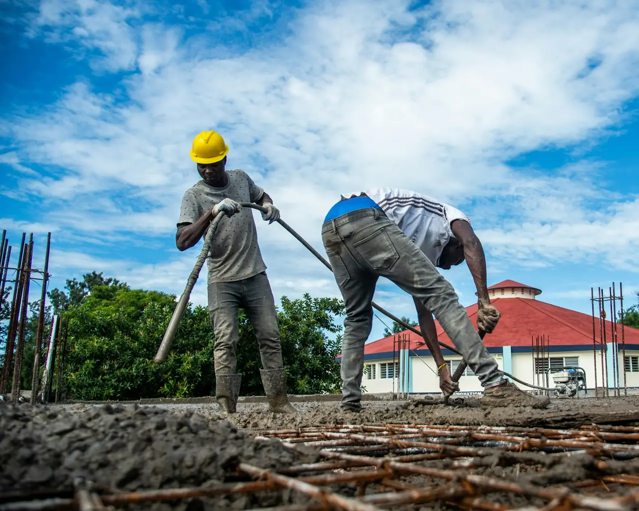 A crew pouring a concrete slab